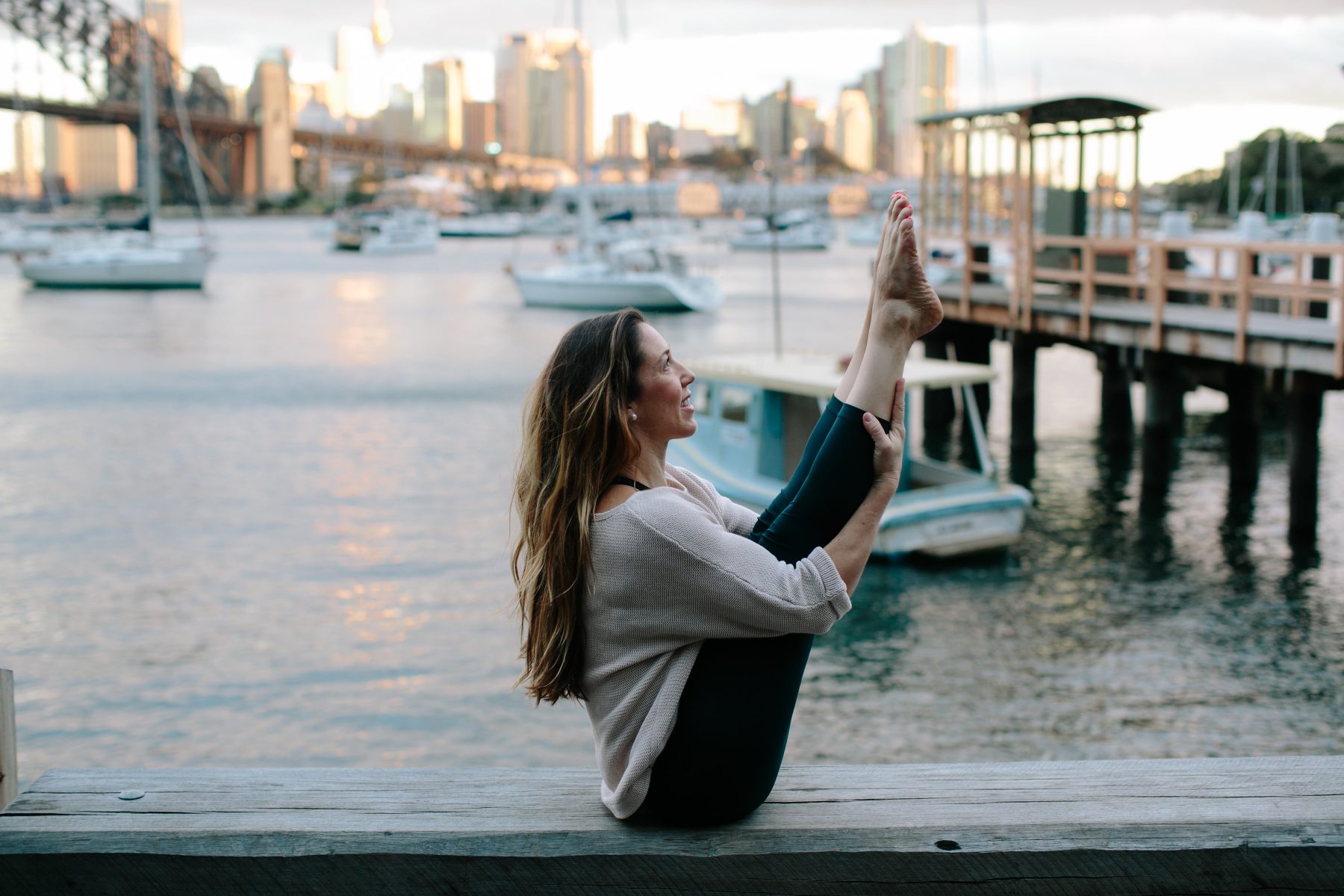 Kat Clayton yoga pilates meditation practice sydney harbour with boats on Sydney NSW Coast