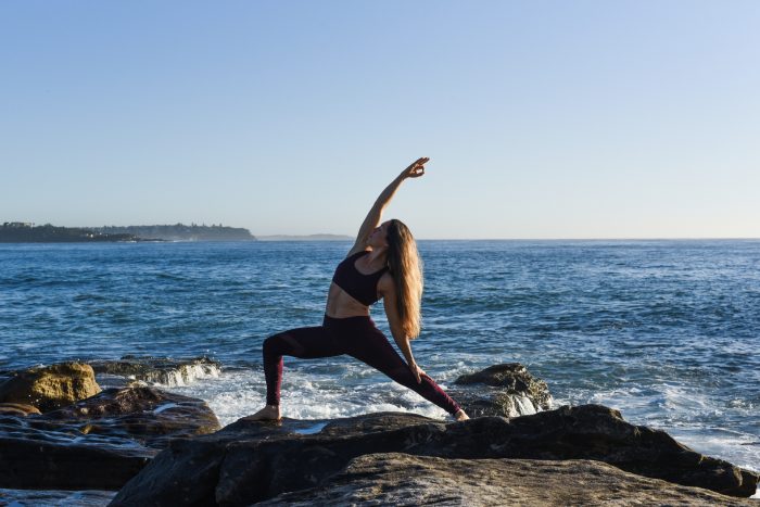 Kat Clayton Yoga reverse warrior ocean yogi